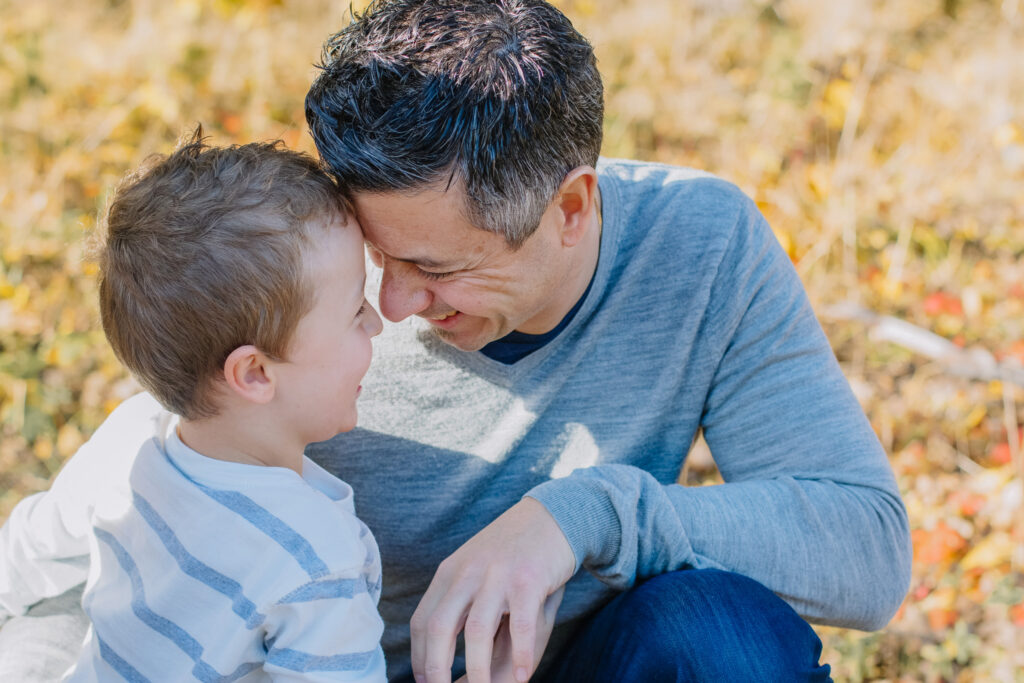 dad and his son having a moment during a family photoshoot in Bayside Melbourne