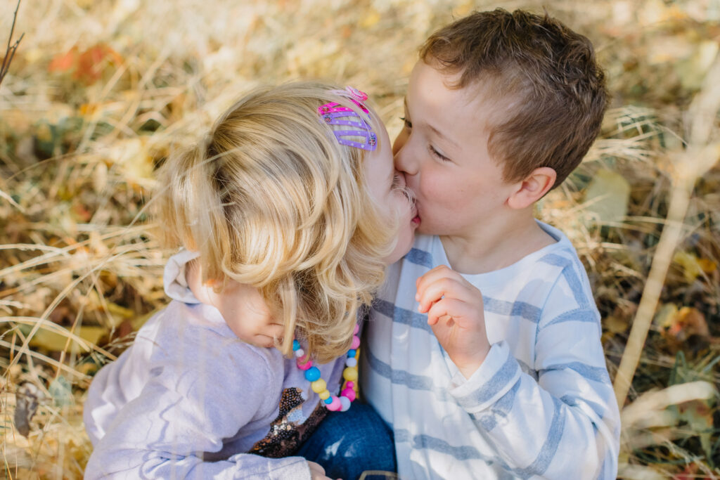 brother and sister cuddle each other during a family photoshoot Melbourne Bayside