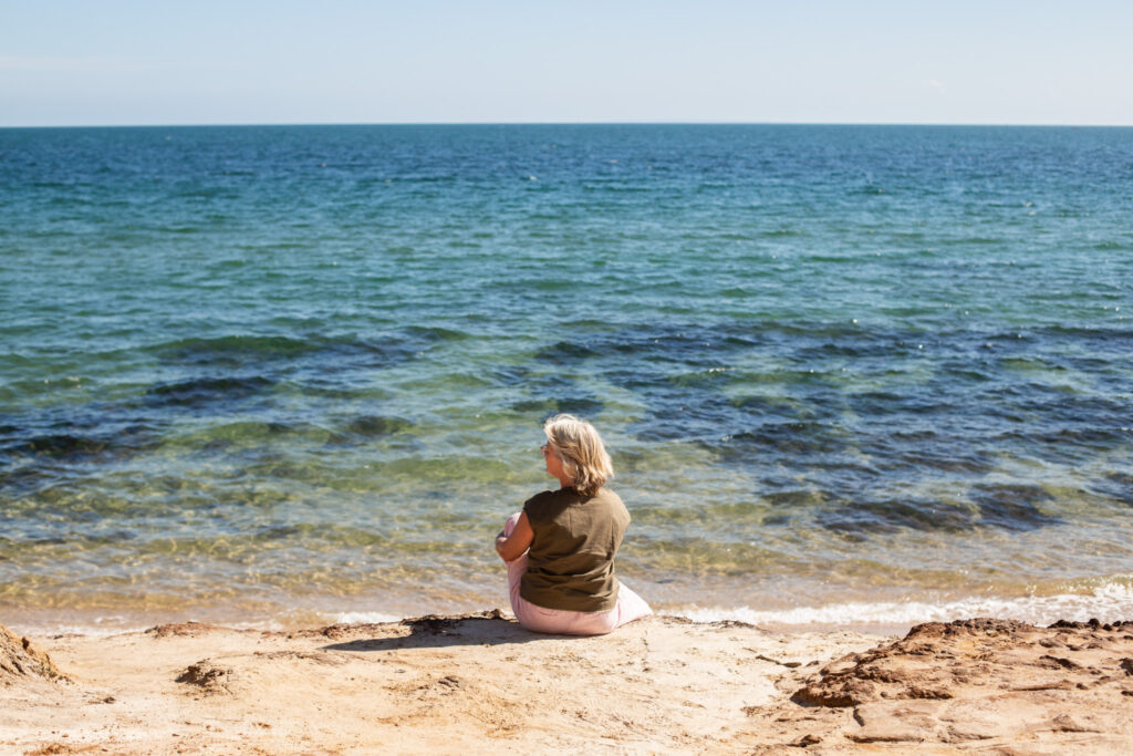 woman at the beach during her personal branding photoshoot