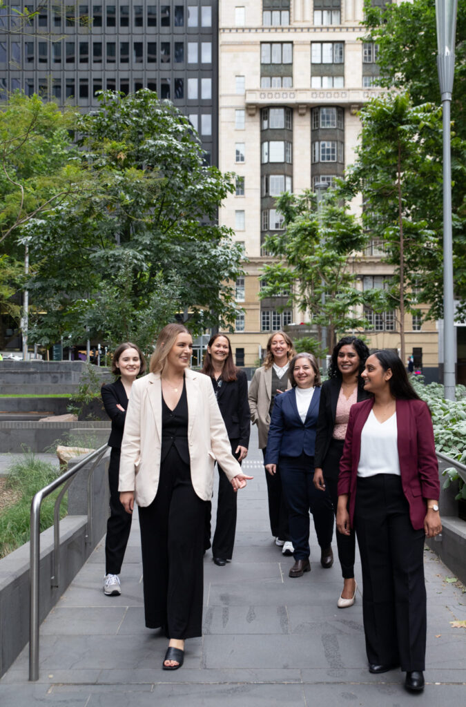 group of women business leaders walking in the city during a group photoshoot